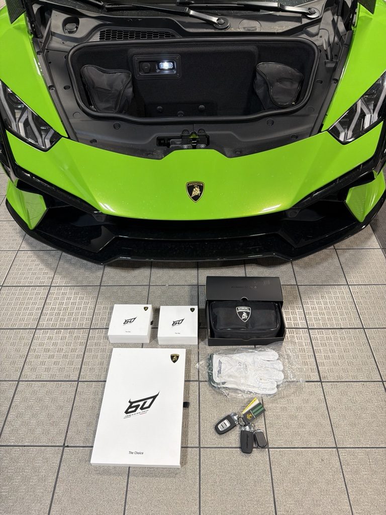 Lamborghini Huracán Tecnica delivery kit with 60th-anniversary presentation boxes, keys and driving gloves