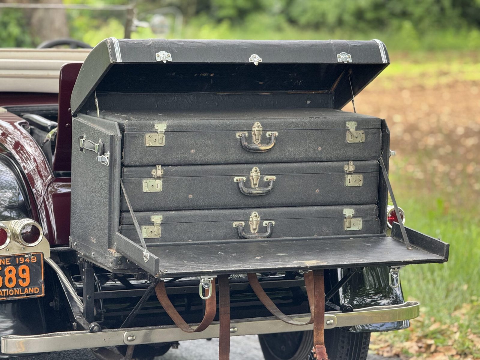 Rear luggage trunk fitted with three suitcases on the Silver Ghost